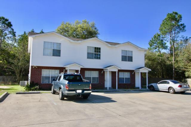 Online Auction: 6 Rental Condos + Dev. Land